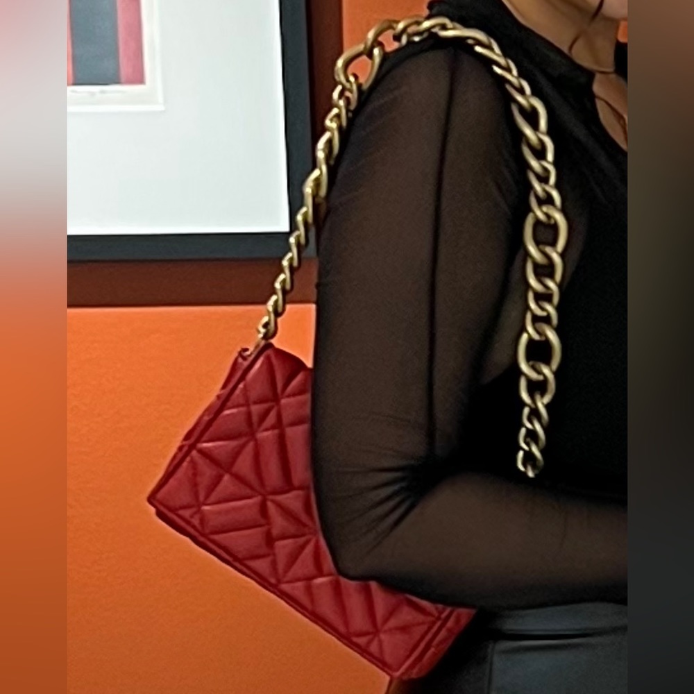 Red bag with gold strap